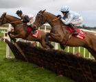 teahupoo-left-and-honeysuckle-jump-a-hurdle-during-the-hattons-grace-at-fairyhouse-ire-04-12-2022