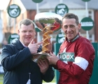 all-smiles-jockey-davy-russell-and-trainer-gordon-elliott-lift-the-grand-national-trophy-(racingpost)