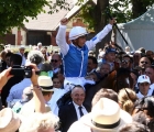 Maxime Guyon celebrates after winning aboard Polydream in the prix Maurice de Gheest-2018