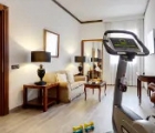 Melià Milano business suite living room with fitness  equipment